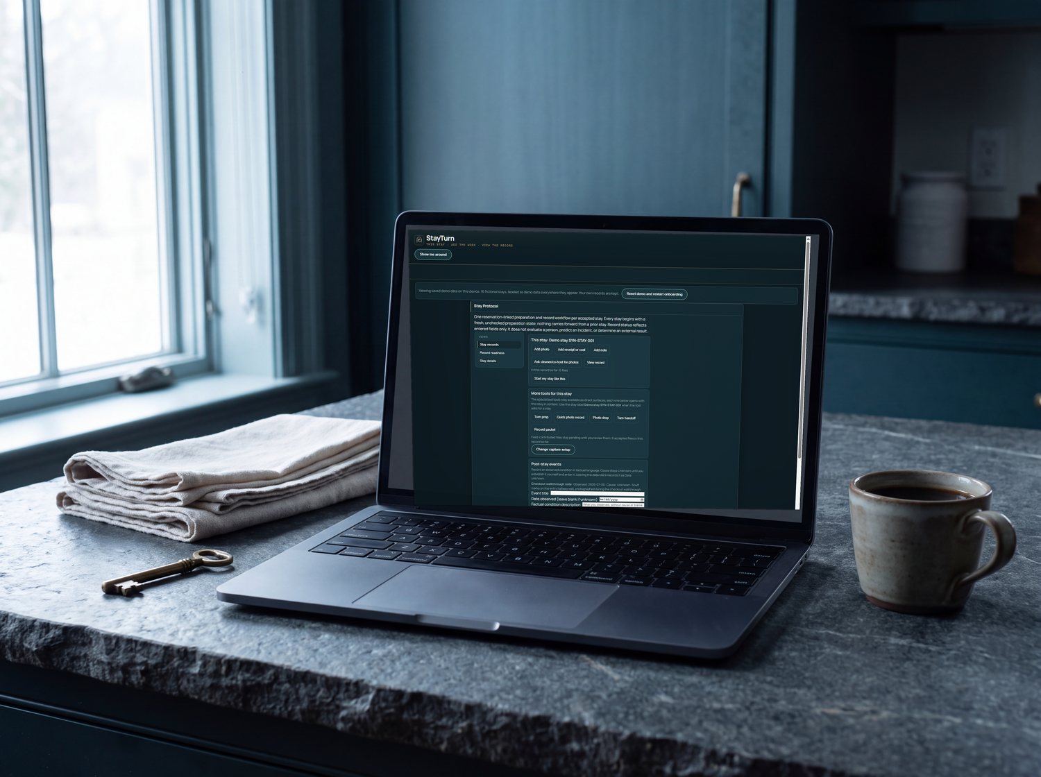 StayTurn open on a laptop in a turned rental kitchen